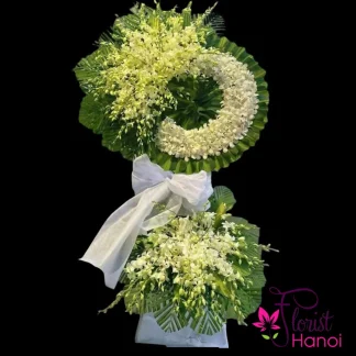 White orchid funeral flower stand on a black background by Florist Hanoi