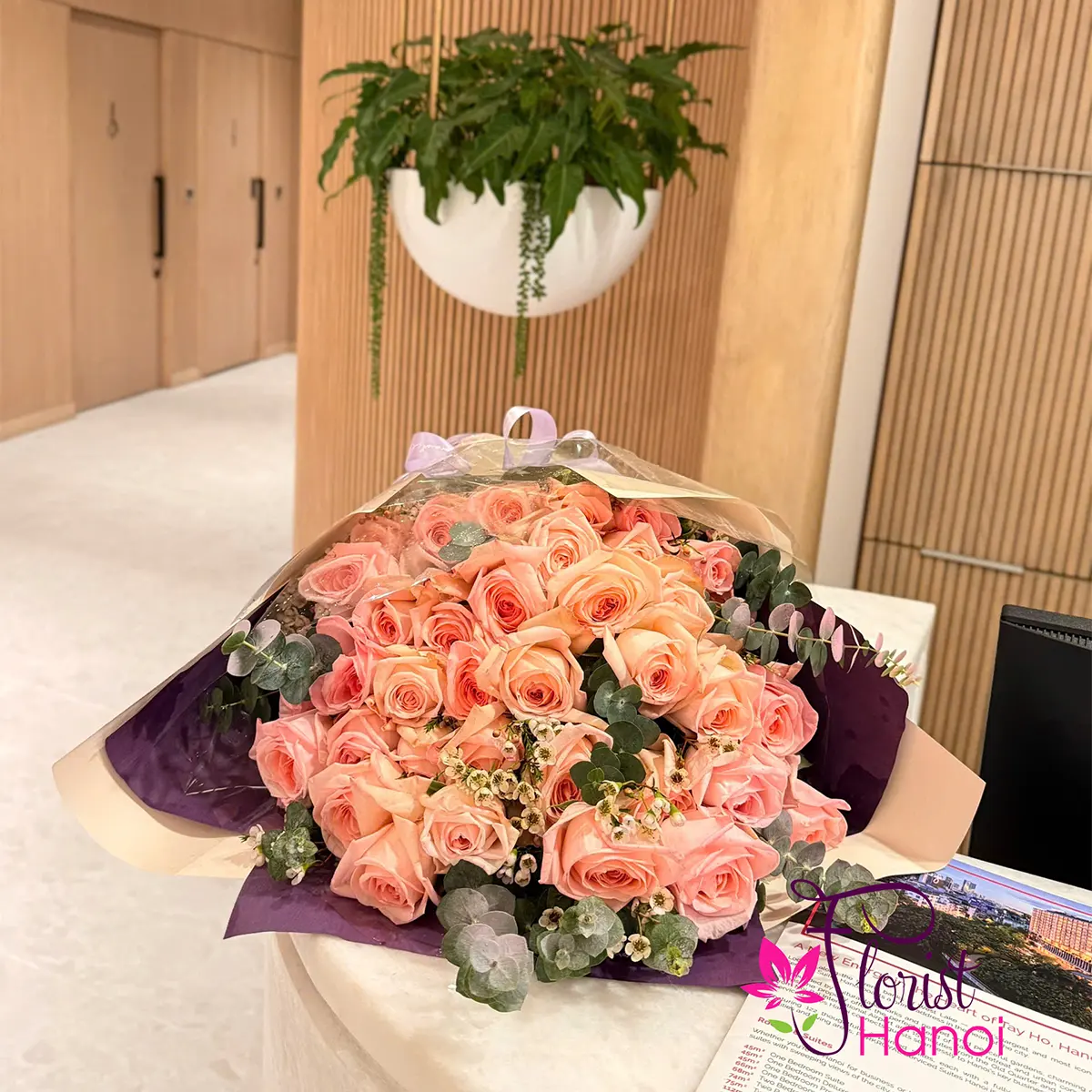 Florist preparing a fresh flower arrangement for delivery