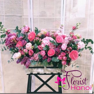 Luxury pink flower basket with garden roses, hydrangeas, and lisianthus for delivery in Hanoi