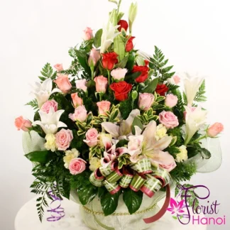Elegant flower basket for her with roses and white lilies in Hanoi