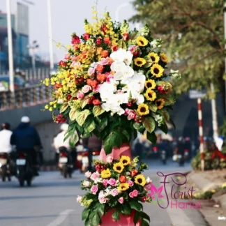 Grand opening flowers stand Hanoi with orchids and sunflowers