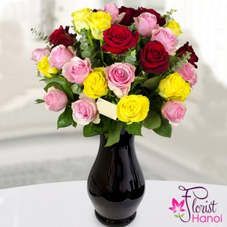 Multi-colored roses in vase