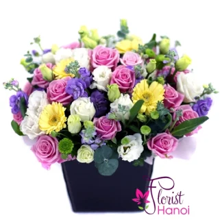 Mixed flowers arrangement with pink roses and yellow gerberas