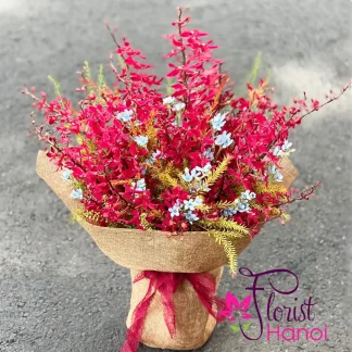 Red orchid and blue flower bouquet for Mother's Day