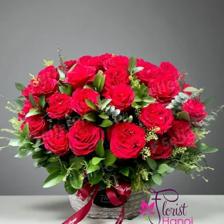 Red roses basket with fresh flowers in Hanoi