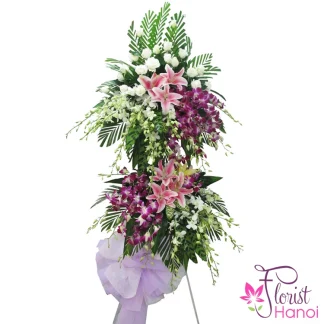 Sympathy flowers delivered fast in Hanoi with white lilies and orchids