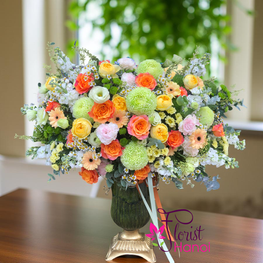 Order vibrant arrangement of orange and green flowers