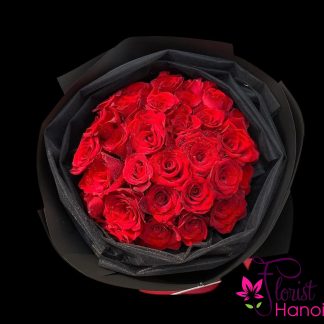 Online red roses wrapped in black paper