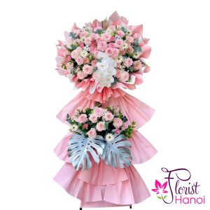 Pink flower stand for grand opening ceremony