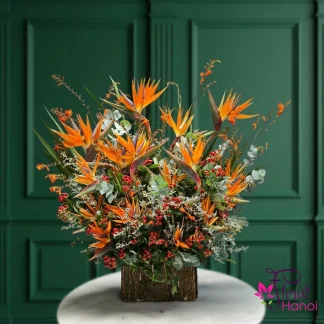 bird of paradise flower arrangement in orange and red